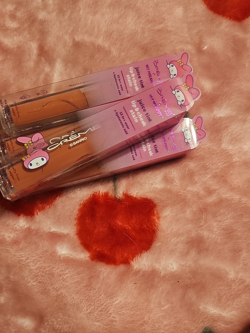 Sanrio My Melody Lip Tint Gloss in Peach-Orange and Pink Packaging